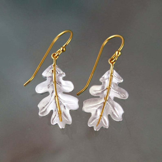 Earrings in Gold With White Leaves